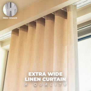 May include: Beige extra wide linen curtain hanging from a track. The curtain is made of a textured fabric and has a neutral color. The text "EXTRA WIDE LINEN CURTAIN A QUALITY" is visible on the bottom right. A free tieback is included.