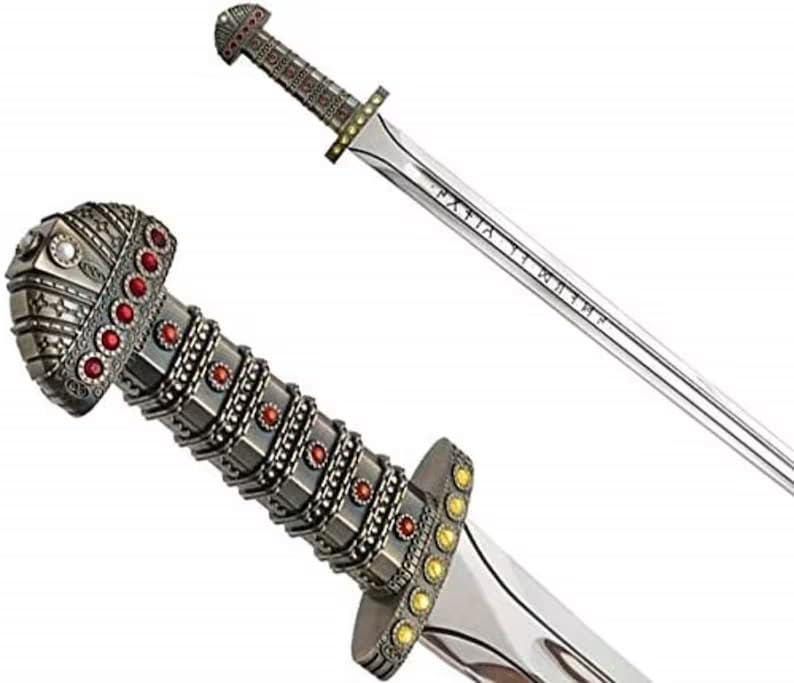 May include: A silver-toned sword featuring a highly detailed hilt adorned with numerous small red circular inlays and a pommel with white accents. The crossguard is decorated with yellow circular inlays, and the blade displays engraved runic text.
