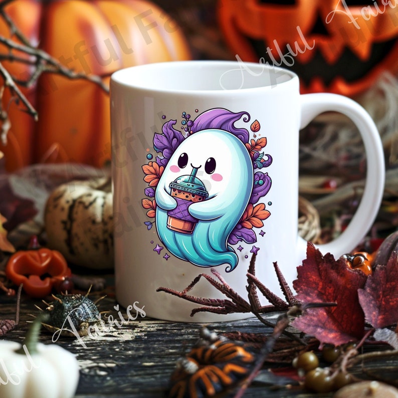 May include: White ceramic mug featuring a cartoon ghost holding a drink. The ghost is light blue with a purple head and is surrounded by purple and orange leaves. The mug has a white handle and is set against a Halloween-themed background.