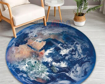 May include: A round area rug featuring a detailed image of Earth, showcasing continents and oceans in shades of blue, brown, and green. The rug's design mimics a satellite view of the planet, suitable for a living room or bedroom.