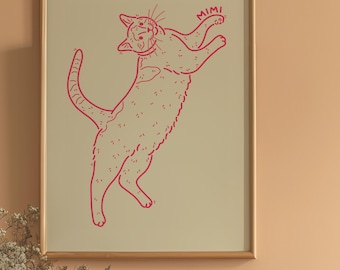 Könnte beinhalten: Ein gerahmter Wandkunstdruck mit einer roten Strichzeichnung einer Katze, die auf einem hellbeigen Hintergrund springt oder sich streckt. Die Katze ist in einer verspielten Pose mit erhobenem Schwanz dargestellt, der Name MIMI steht in Rot daneben.
