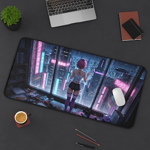 May include: A black rectangular desk mat featuring a vibrant anime-style illustration of a person gazing out a window at a futuristic cityscape with neon signs. The mat includes a laptop, mouse, and coffee cup.