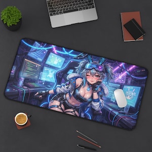 May include: A rectangular desk mat featuring a vibrant anime-style illustration of a character with blue hair, bunny ears, and futuristic gear. The character is set against a dark, neon-lit background with computer monitors displaying code and graphics.