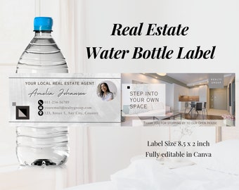 May include: A customizable water bottle label template for real estate agents. The label features a photo of a woman, contact information, and the text "Your Local Real Estate Agent". The label also includes a photo of a modern living room with the text "Step into your own space". The label is 8.5 inches by 2 inches and is fully editable in Canva.