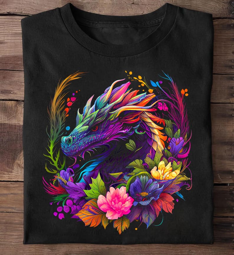 May include: A black t-shirt with a colorful graphic of a dragon's head surrounded by flowers. The dragon is purple, blue, and green, and the flowers are pink, yellow, and blue.