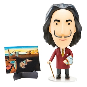 May include: A red and black figurine of Salvador Dali holding a melting clock in his right hand and a cane in his left hand. The figurine is standing on a clear plastic base. A small painting of Dali's "The Persistence of Memory" is in the background.