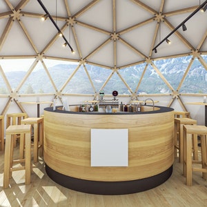 May include: A wooden bar counter with stools in a geodesic dome structure with large windows overlooking a mountain landscape.