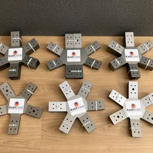 May include: Six gray metal star-shaped connectors with the text "KASTDOME" printed on each. The connectors are stacked on top of each other.