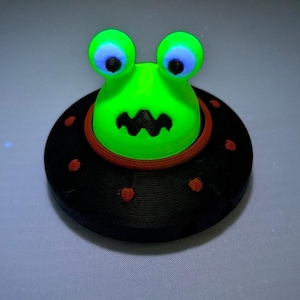 Glowing Alien UFO Fidget Clicker black/red, size 2 inch space birthday sci-fi