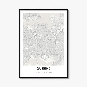May include: A framed wall art print featuring a detailed grey and white street map of Queens, New York City. The map displays a complex network of roads and waterways on a light background, with the text QUEENS NEW YORK CITY, NEW YORK below.