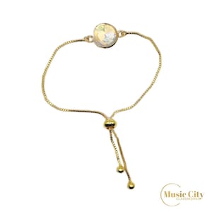 Gold Slider Bracelets with a Variety of Medium-Sized Fused Glass Cabochon Colors