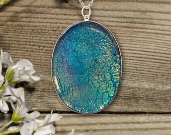 Sparkling Teal Oval Dichroic Fused Glass Pendant in Sterling Silver Frame