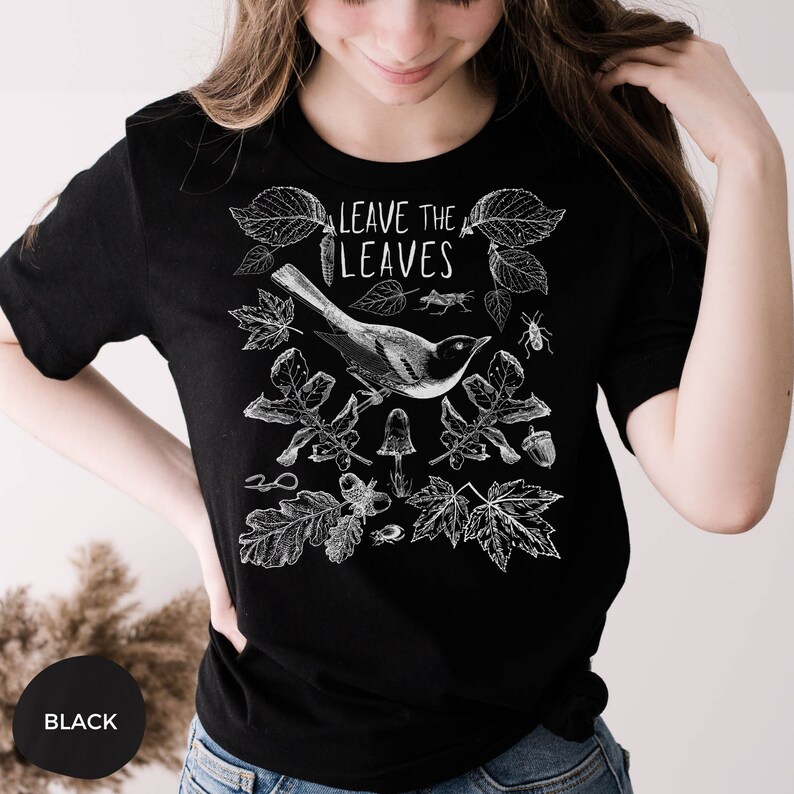 May include: Black t-shirt with a white illustration of a bird, leaves, and the text "LEAVE THE LEAVES".