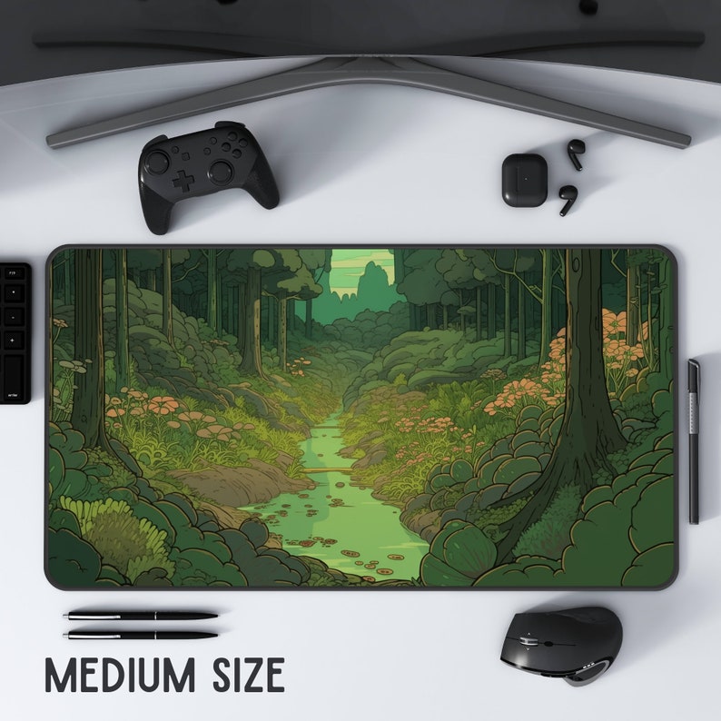 May include: A green and brown illustrated forest scene with a winding stream running through the center. The scene is surrounded by a black border. The text "MEDIUM SIZE" is printed below the image.