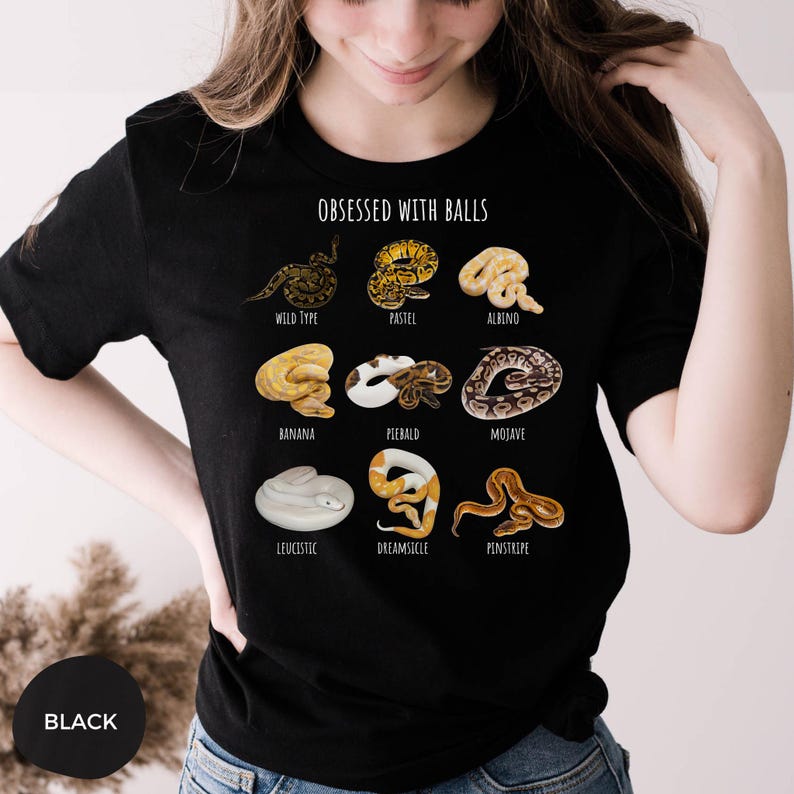 May include: Black t-shirt with the text "OBSESSED WITH BALLS" and illustrations of various snake morphs, including Wild Type, Pastel, Albino, Banana, Piebald, Mojave, Leucistic, Dreamsicle, and Pinstripe. The word "BLACK" is in a circle at the bottom.