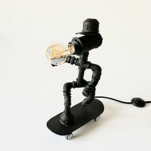 Skateboarder Lamp – Industrial Pipe Lamp with Moving Wheels – Handmade Desk Light – Cool Gift for Skater Fans
