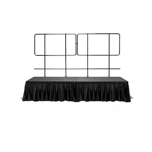 May include: Black stage with a black skirt and a black metal railing.