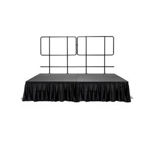 May include: Black stage with a black skirt and a black metal railing.