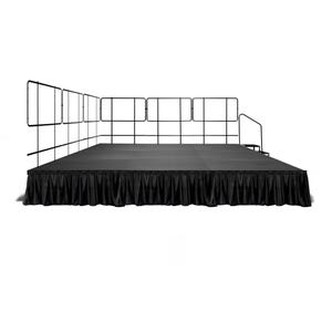 May include: A black stage with a black skirt and a black metal railing around the perimeter.