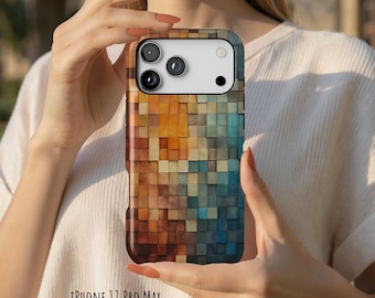 May include: A glossy iPhone 17 Pro Max phone case featuring a multi-colored mosaic pattern of small square tiles in shades of orange, brown, blue, and cream. The design covers the back of the case, which has a cutout for the camera lenses.