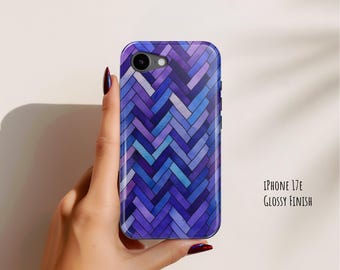 May include: A phone case for an iPhone 17E with a glossy finish, featuring a repeating herringbone pattern in shades of deep purple, violet, and bright blue. The design covers the entire back surface, including a circular cutout for the camera lens.