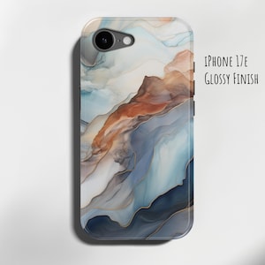 May include: iPhone 17E phone case with a glossy finish. The case has an abstract design with flowing patterns in blue, brown, and gold. The design resembles watercolour or marble art.