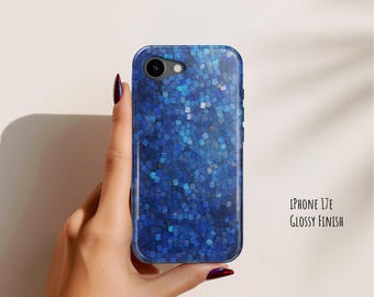 May include: A phone case for an iPhone 17E with a glossy finish, featuring a mosaic pattern of small, square-shaped tiles in various shades of deep blue, navy, and light blue. The text iPhone 17E Glossy Finish is printed to the right of the case.