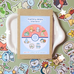 May include: A brown paper bag with a sticker on it. The sticker is a Pokeball with a pink background and 9 different Pokemon characters on it. The text on the sticker reads "mystery derpy starters! contains 5 mystery stickers! gen 1-9 collect all 27 designs!"
