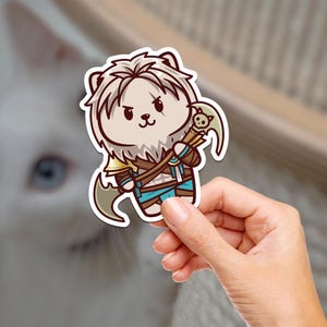 May include: A cartoon sticker of a white furry creature with a brown mane, wearing a blue and brown outfit and holding an axe. The creature has a serious expression and is looking to the right.