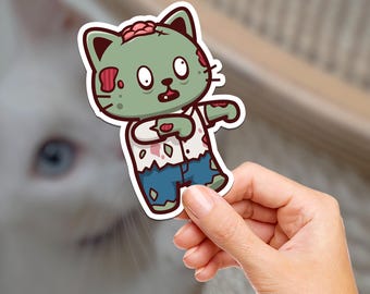 Puede incluir: Una pegatina de gato zombie verde con una camisa blanca y pantalones vaqueros azules. El gato tiene una expresión de sorpresa y está extendiendo los brazos.