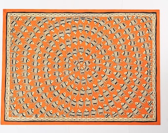 May include: An orange rectangular textile features a repeating pattern of stylized fish. Each fish is depicted in black and white with a detailed design. The border is a darker orange with a black and white patterned trim.