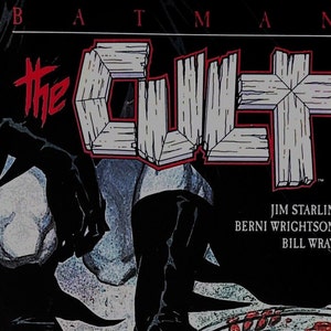 May include: Comic book cover featuring Batman in a dark, shadowy pose with the title "The Cult" in red and white lettering. The text "Book One: Ordeal" is on the left side of the cover. The creators' names, Jim Starlin, Berni Wrightson, and Bill Wray, are listed at the bottom.