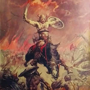May include: A warrior on horseback charges into battle, wielding a sword and shield. The warrior is clad in armor and has a horned helmet. The background is a fiery landscape with other warriors fighting.