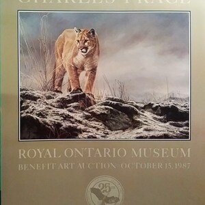May include: A poster advertising a benefit art auction for the Royal Ontario Museum. The poster features a painting of a cougar in a snowy landscape. The text on the poster reads "Charles Frac&eacute;" and "Royal Ontario Museum Benefit Art Auction October 15, 1987".