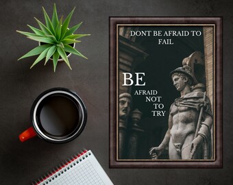 May include: A motivational quote poster with a black frame and a vintage-style image of a Roman statue. The quote reads "Don't be afraid to fail. Be afraid not to try."