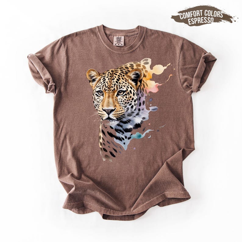 A brown t-shirt with a colorful graphic of a leopard printed on it.