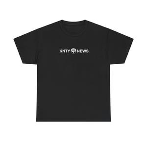 May include: Black t-shirt with a white logo that says "KNTY 24 NEWS"