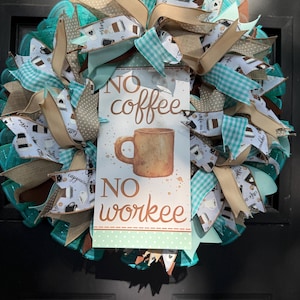 May include: A coffee-themed wreath with turquoise mesh, patterned ribbons, and a sign that reads "NO coffee NO workee." The sign features a watercolor illustration of a coffee mug. The wreath is decorated with various ribbons in shades of brown, white, and turquoise.