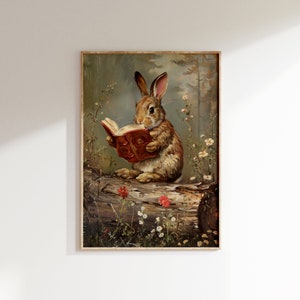 May include: A painting of a brown rabbit sitting on a log in a woodland setting. The rabbit is holding a red book in its paws and appears to be reading. The background is a soft green and brown with flowers and trees.