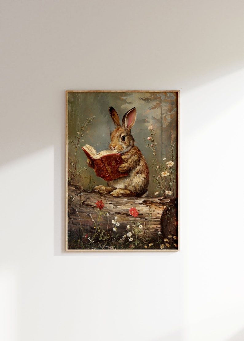 May include: A painting of a brown rabbit sitting on a log in a woodland setting. The rabbit is holding a red book in its paws and appears to be reading. The background is a soft green and brown with flowers and trees.
