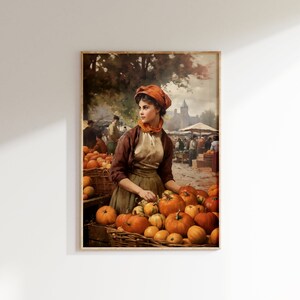 May include: A painting of a woman in a brown dress and orange hat selling pumpkins at a market. The woman is standing behind a table full of pumpkins, and there are other people in the background.