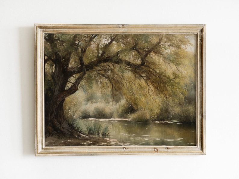 May include: A framed painting depicting a serene landscape with a large tree overhanging a still pond. The painting is done in muted tones of green, brown, and yellow, creating a peaceful and tranquil atmosphere.