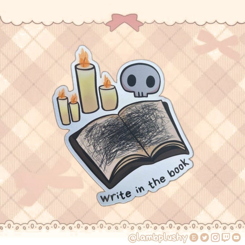 May include: A sticker featuring a skull, three lit candles, and an open book with scribbled pages. The text "Write in the book" is below the book. The sticker has a silver border and a cartoonish style.