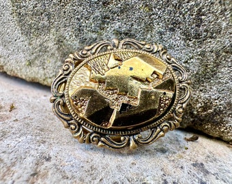 Pince à robe vintage dorée
