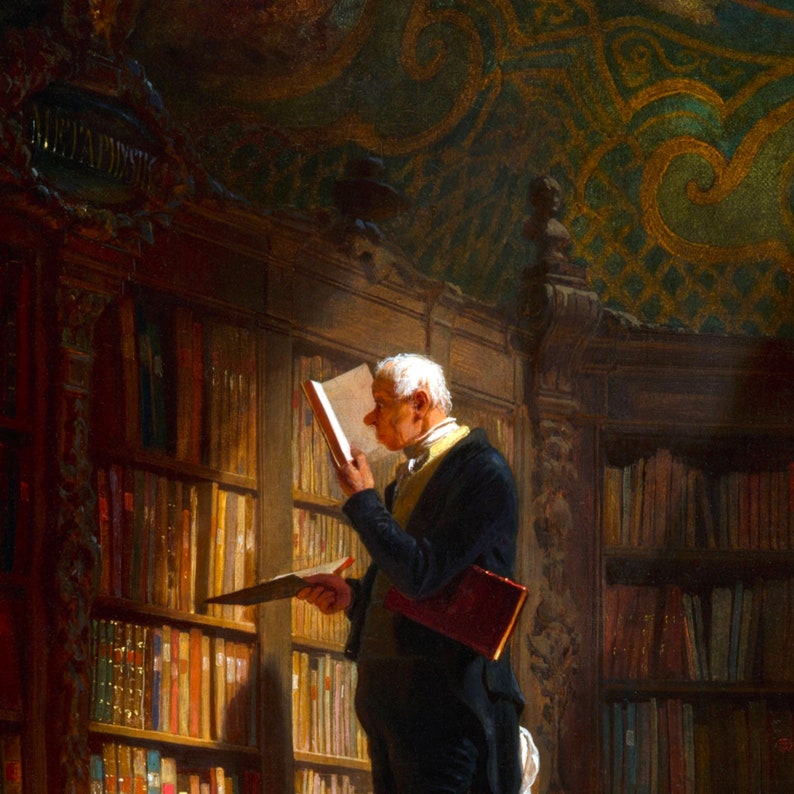 May include: A man in a dark suit and white shirt stands in a library, reading a book. He is surrounded by bookshelves filled with books. The library has a high ceiling with ornate details.