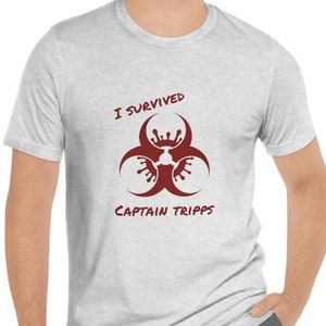 May include: A heather grey t-shirt with a red biohazard symbol and the text "I survived Captain Tripps".