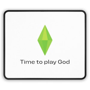 May include: A white mouse mat with a green diamond-shaped icon and the text "Time to play God".