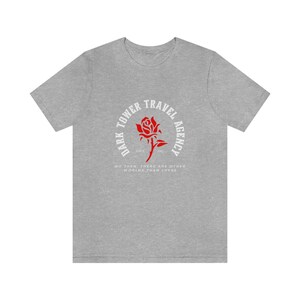 Dark Tower Travel Agency Camiseta de manga corta de jersey unisex Fans de Stephen King, amantes de los libros, lectura, regalos para lectores, serie Dark Tower Athletic Heather