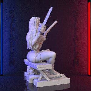 May include: A white 3D-printed figurine of a woman holding a chainsaw and a gun, seated on a bench. The figurine is on a rectangular base. The background is dark with blue and red vertical light bars and the word "ST FALLEN" on the walls.