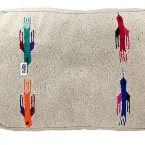 May include: A beige throw pillow with a zipper closure features a repeating pattern of colorful birds. The birds are embroidered in shades of red, orange, blue, green, and purple.